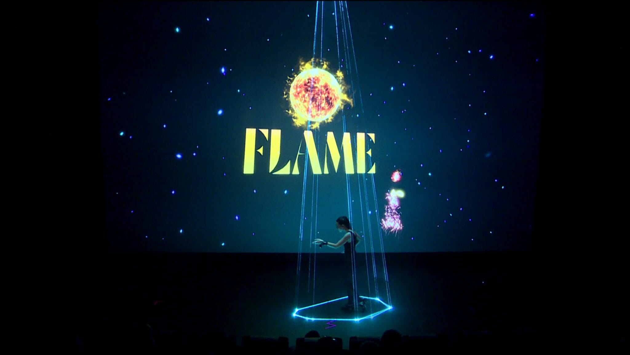"Flame" mixed reality flamenco show: dancer under a beam of light