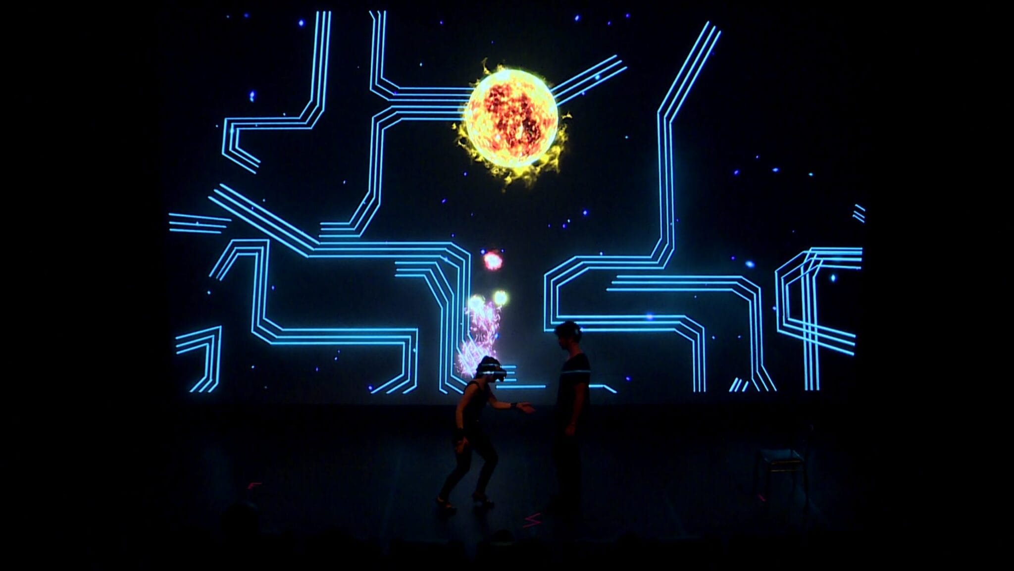 Performers in VR headsets in front of a light projection, Flame show at Forum des Halles