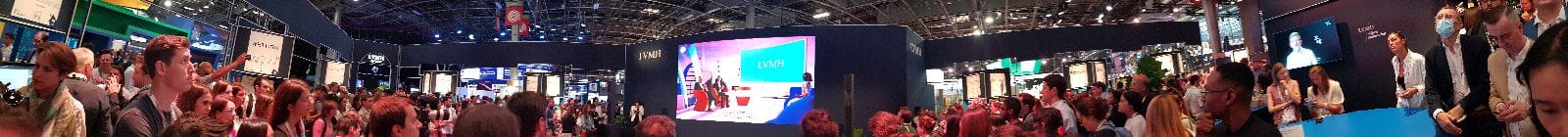 Crowd of spectators watching Livi, LVMH's avatar, being interviewed at VivaTech