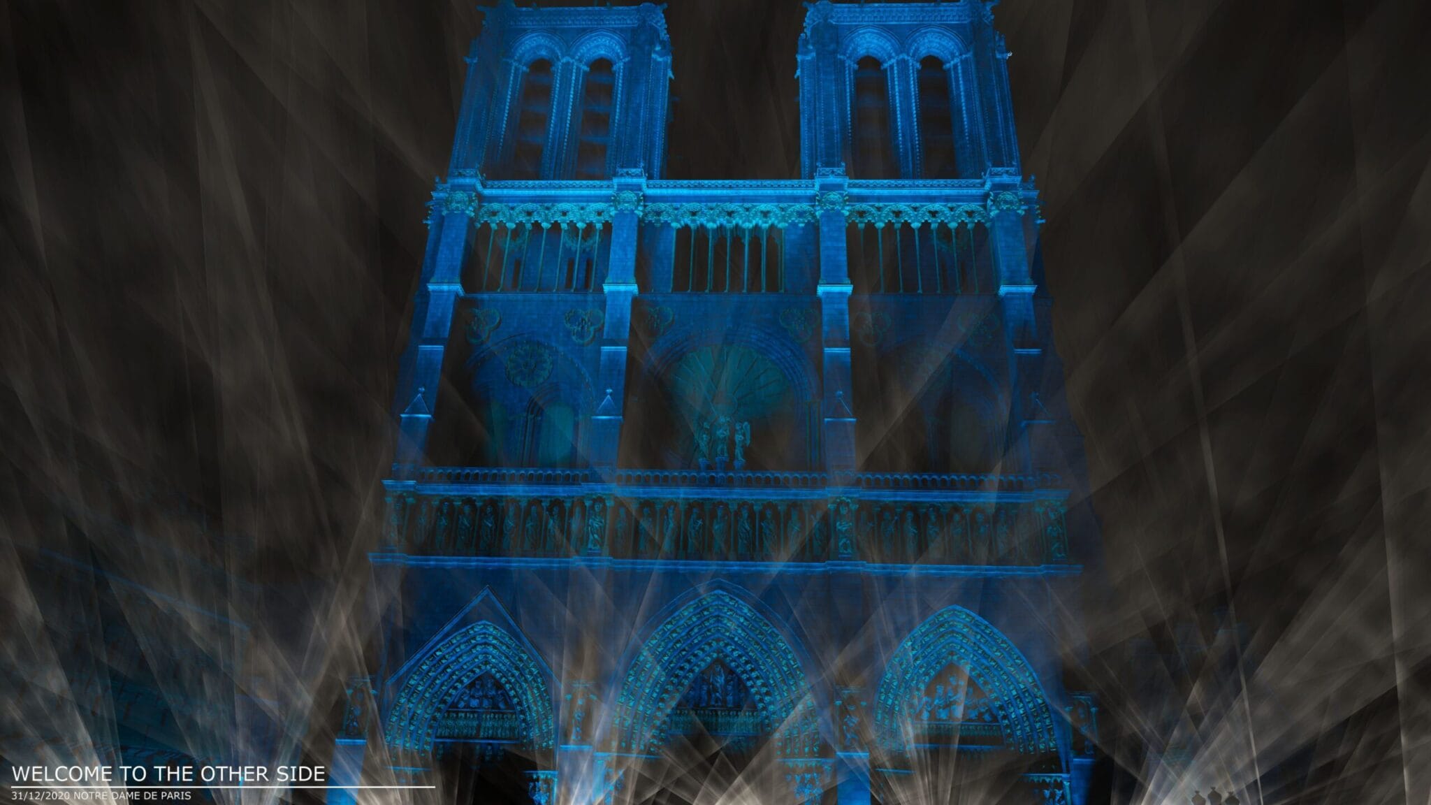 Virtual Notre-Dame de Paris facade lit in blue, Jean-Michel Jarre concert
