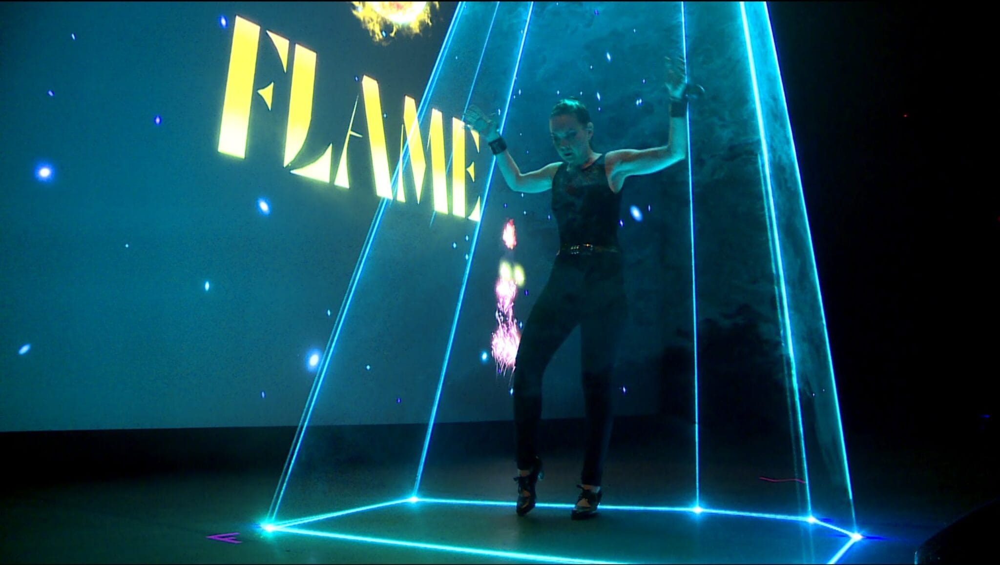Flamenco dancer in a cone of light, Flame at the NewImages Festival