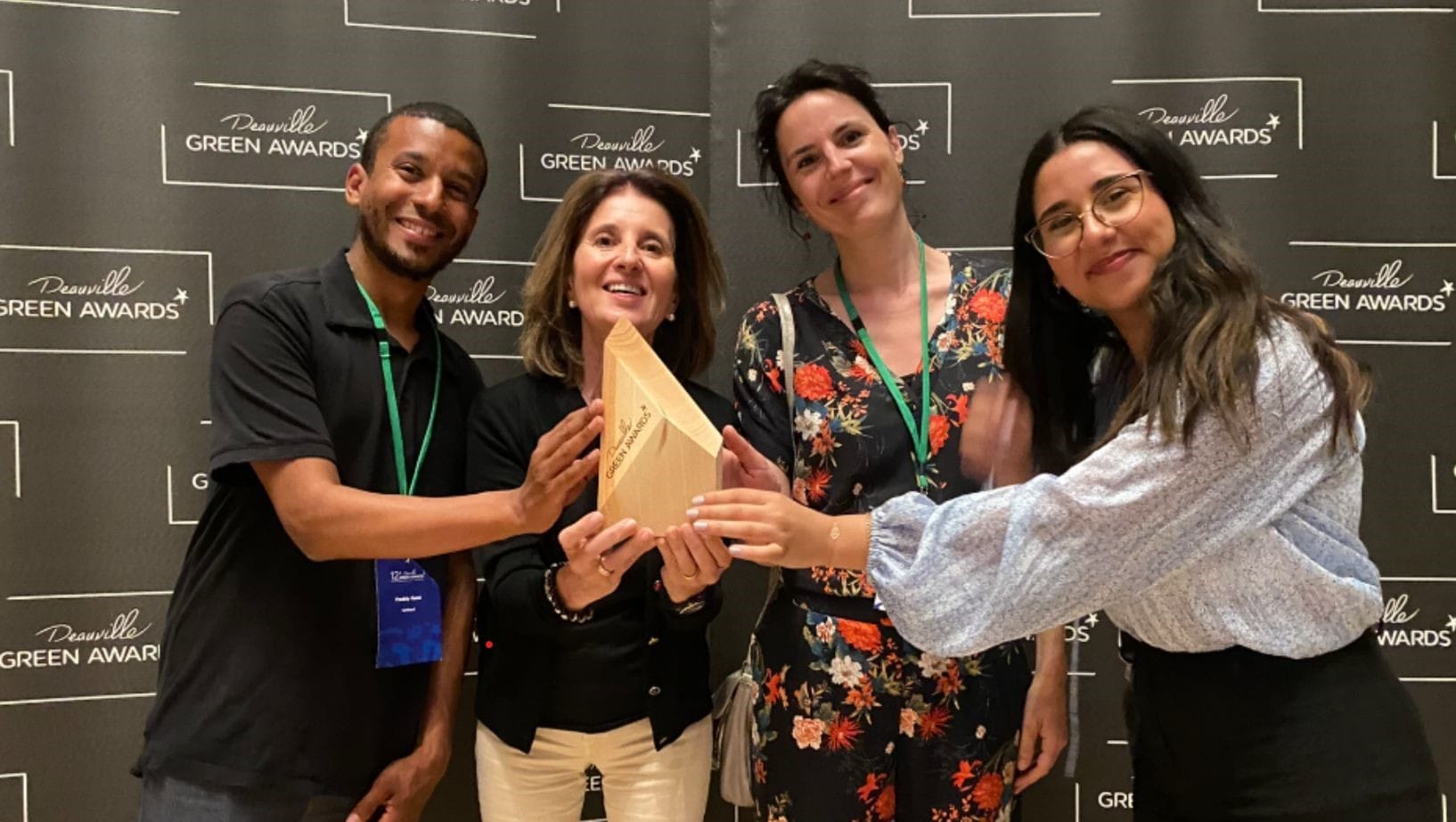 SoWhen? and Michelin teams holding the Deauville Green Awards gold trophy