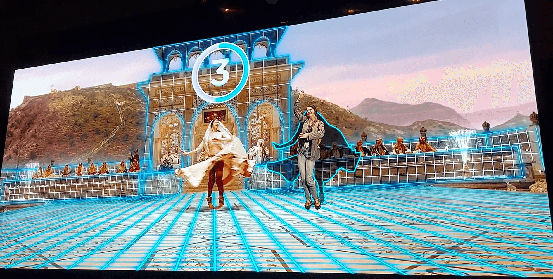 Bollywood immersive experience screen: visitors keyed in among the dancers