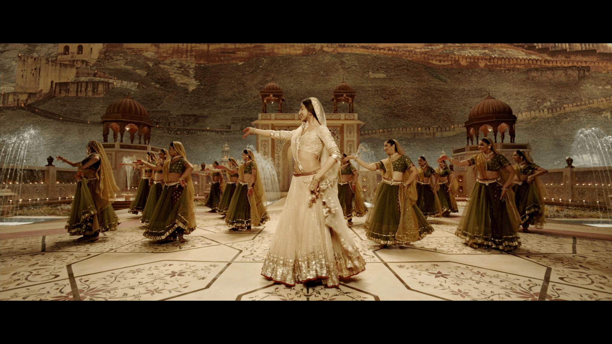 Bollywood dance scene in front of a palace, immersive experience set