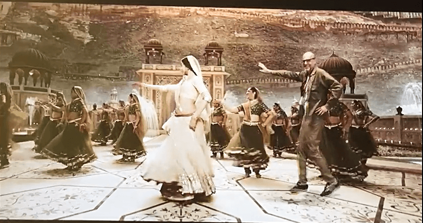 Visitor dancing keyed into a Bollywood scene, Louvre Abu Dhabi