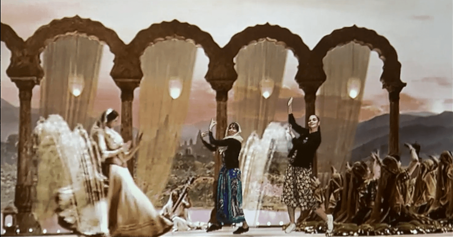 Bollywood dancers under palace arches, immersive experience set
