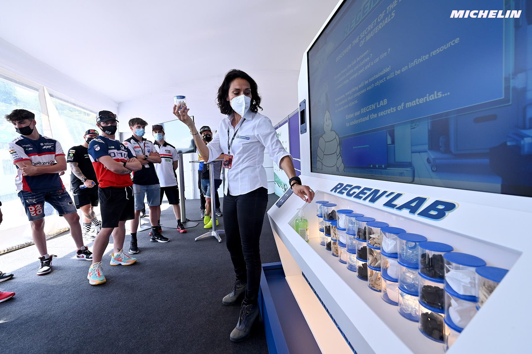Host presenting the Michelin Regen'Lab model to motorcycle riders