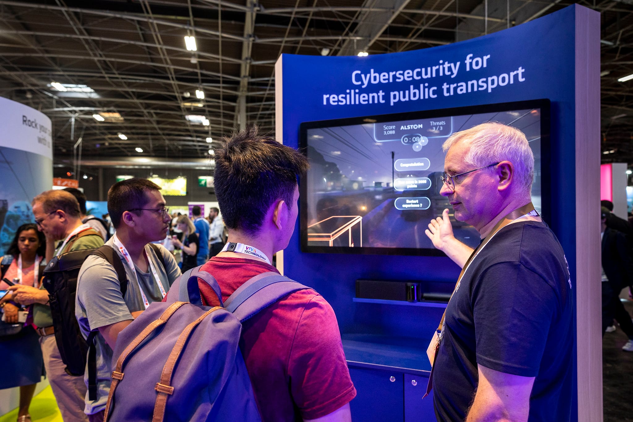 Visitors playing Alstom's "Invisible threats" serious game at VivaTech