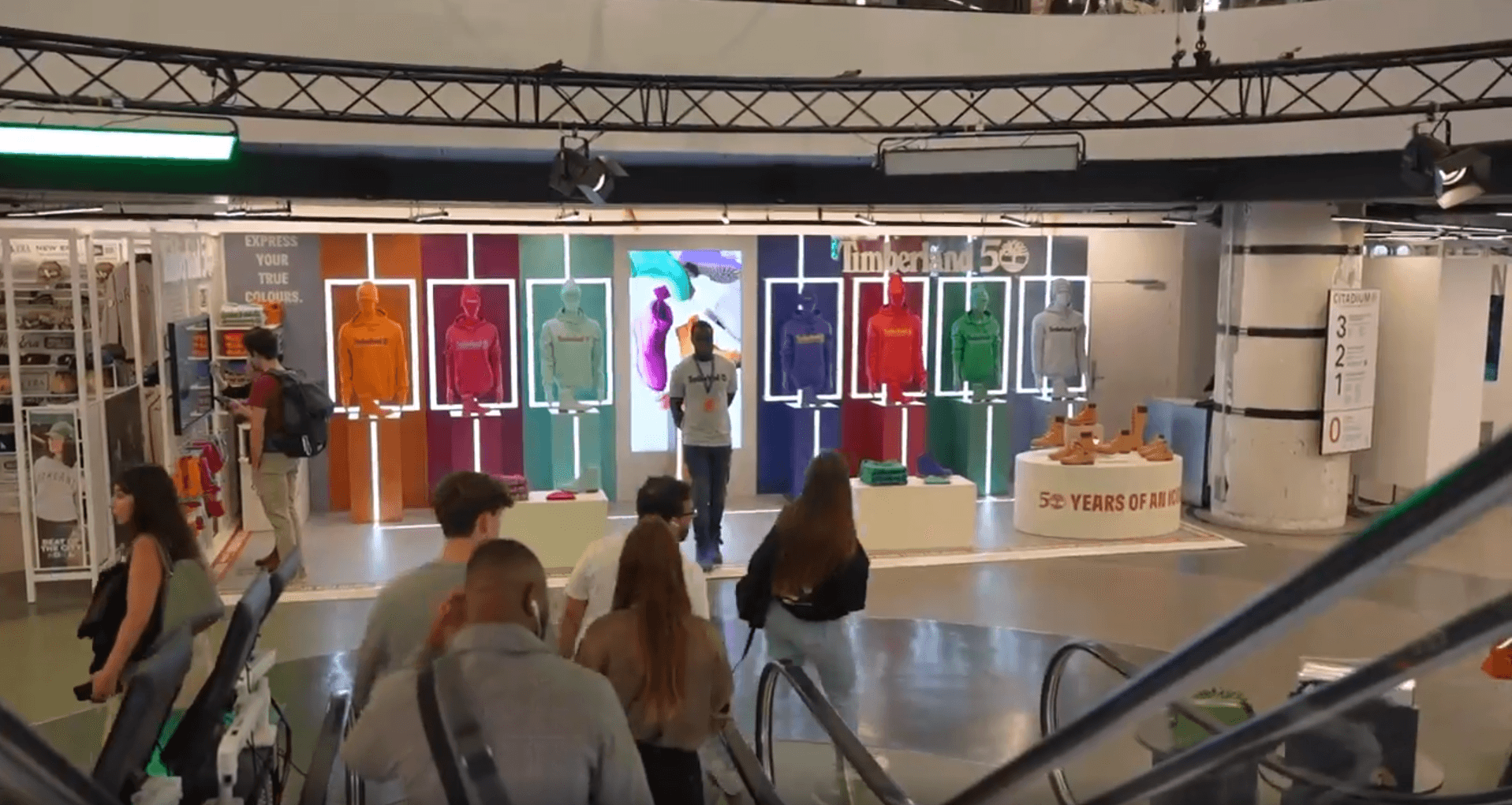 Timberland's colourful stand at Citadium seen from the escalator