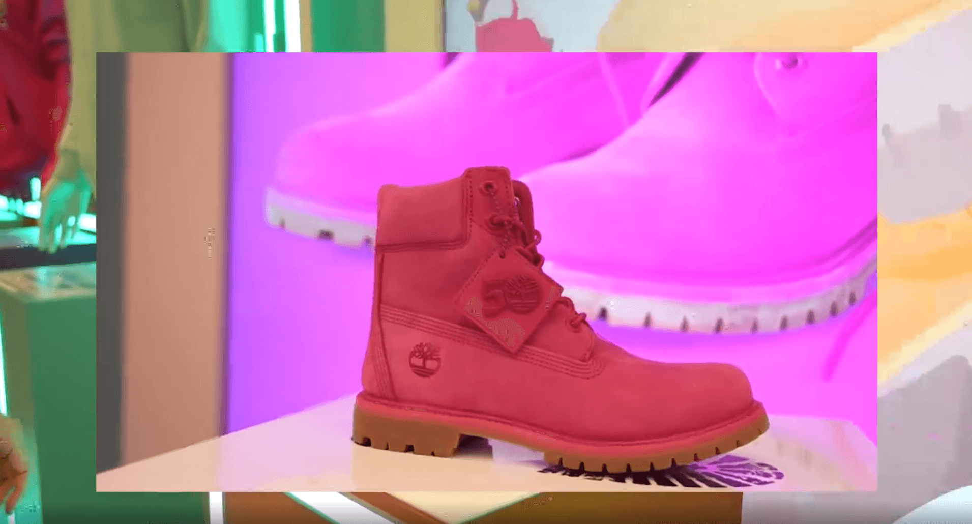Pink Timberland boot on the interactive plinth, pink content on screen