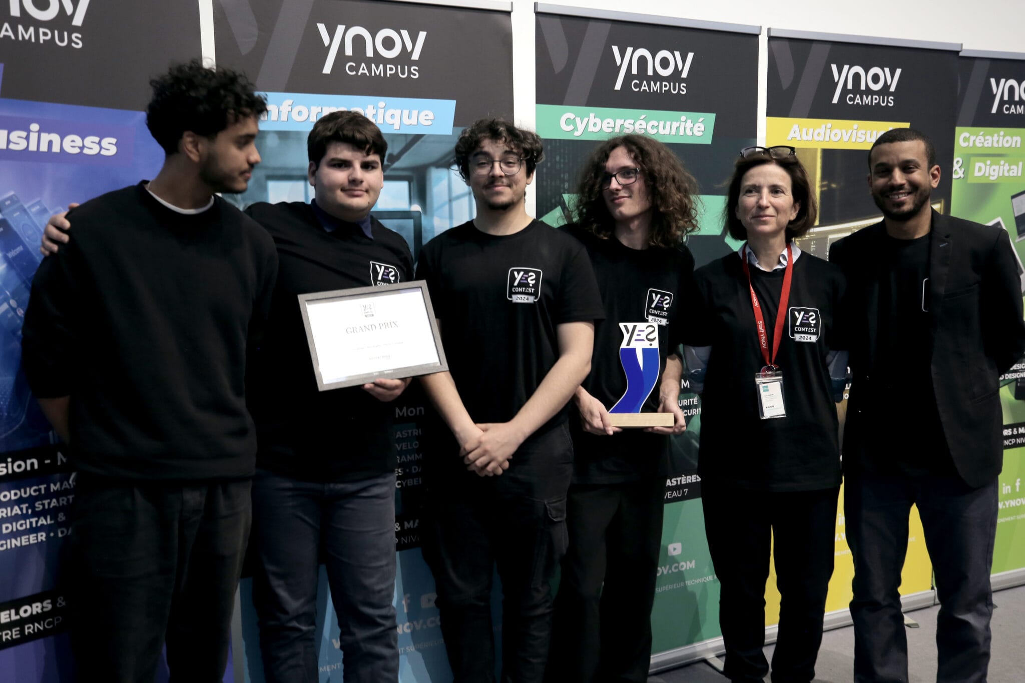 Winners of the Ynov x SoWhen? Fortnite contest posing with their certificate and trophy