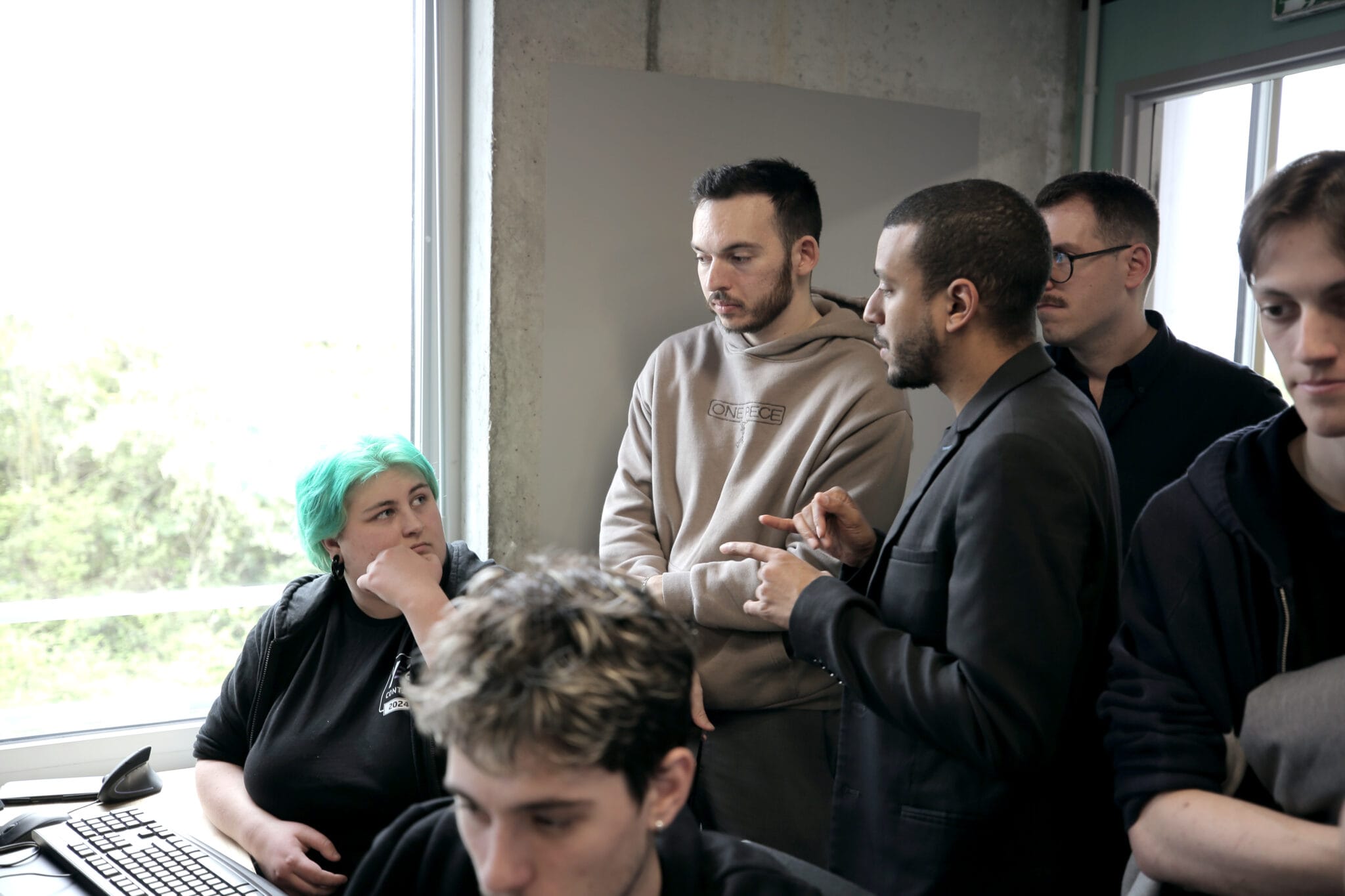 Jury members talking with students about their Fortnite games
