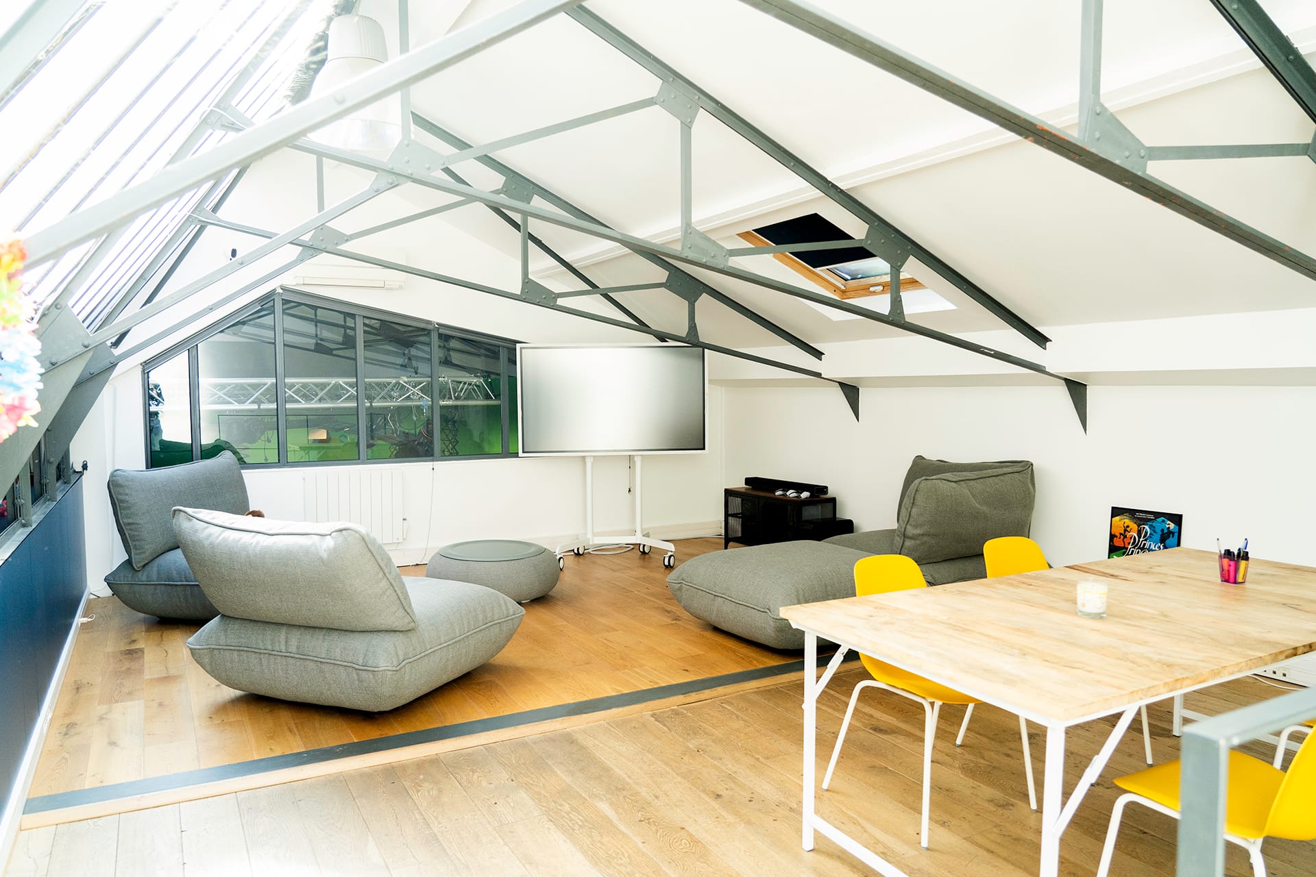 Bright lounge area under a glass roof at SoWhen?'s premises