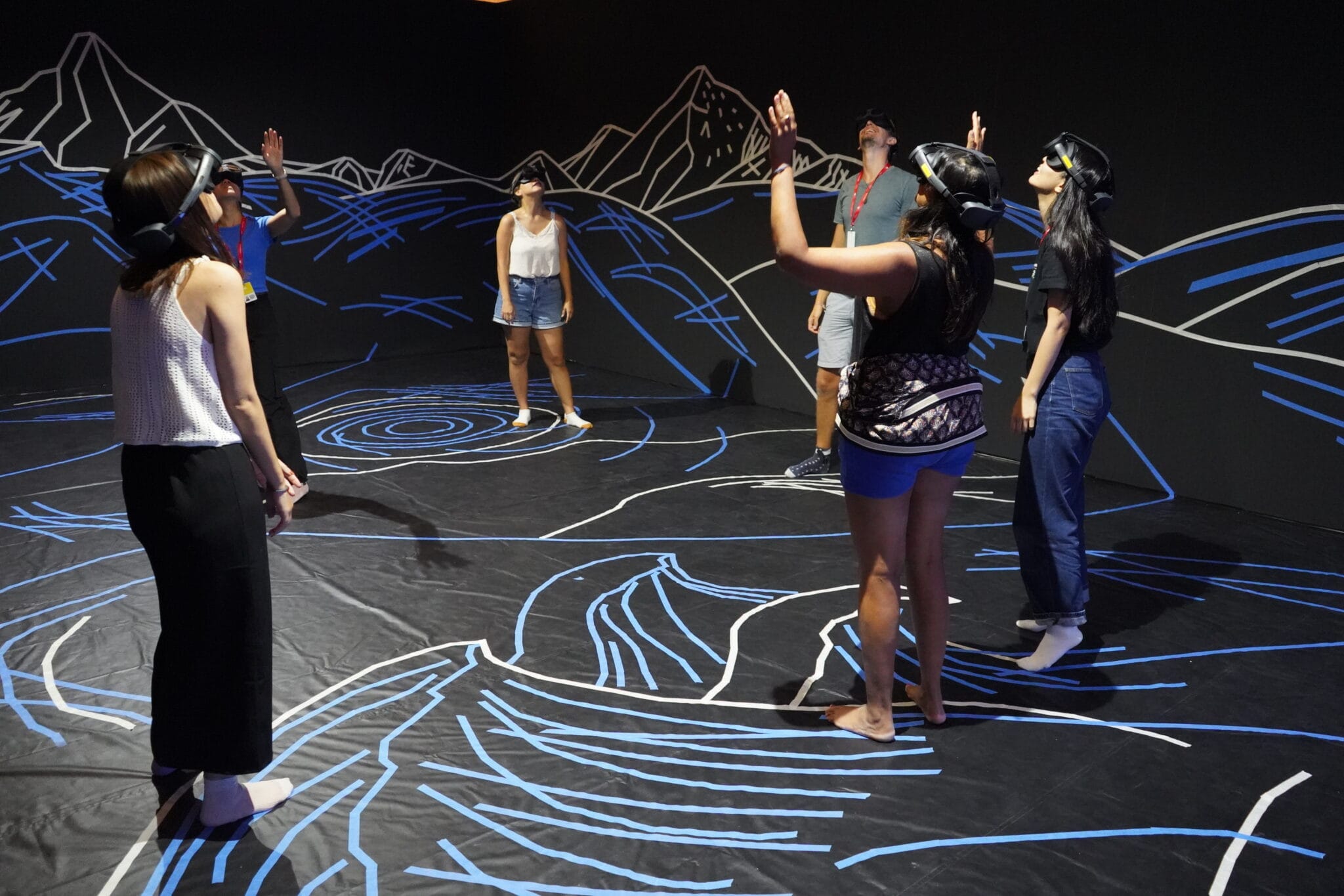 Visitors in VR headsets inside the "Encounters" installation at Venice Immersive 2024