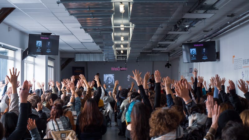 Audience raising hands during the SoWhen? x Isart Connect talk on Unreal Engine