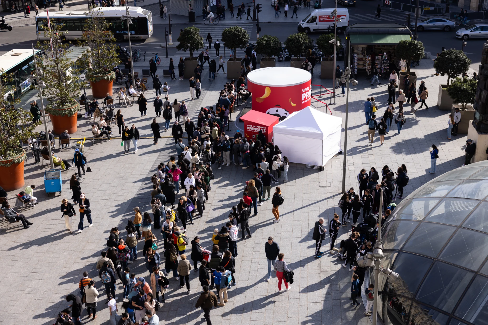 Crowd around the Pringles x Mario stand on a Paris forecourt, aerial view