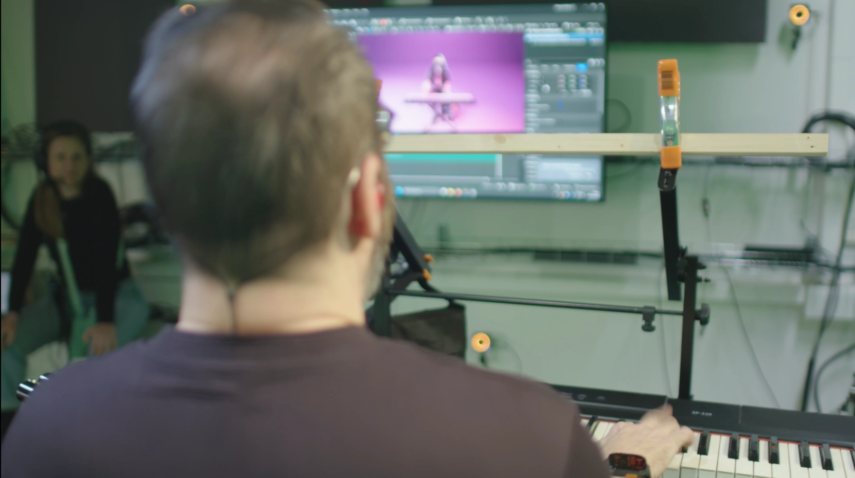 Keyboardist in motion capture in front of a UEFN screen, Turbo Killer shoot